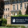George Fox University campus sign in front of brick building